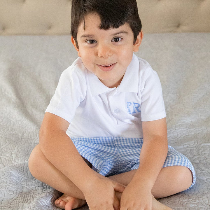 Boy in white polo and blue shorts, DG7A3857