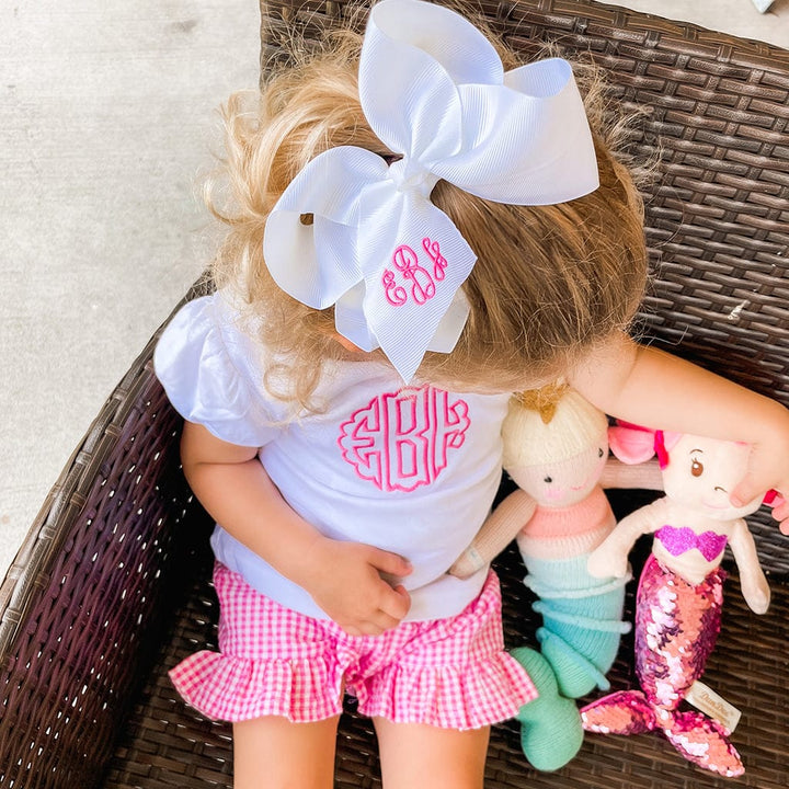 Pink shorts set with monogrammed shirt and bow