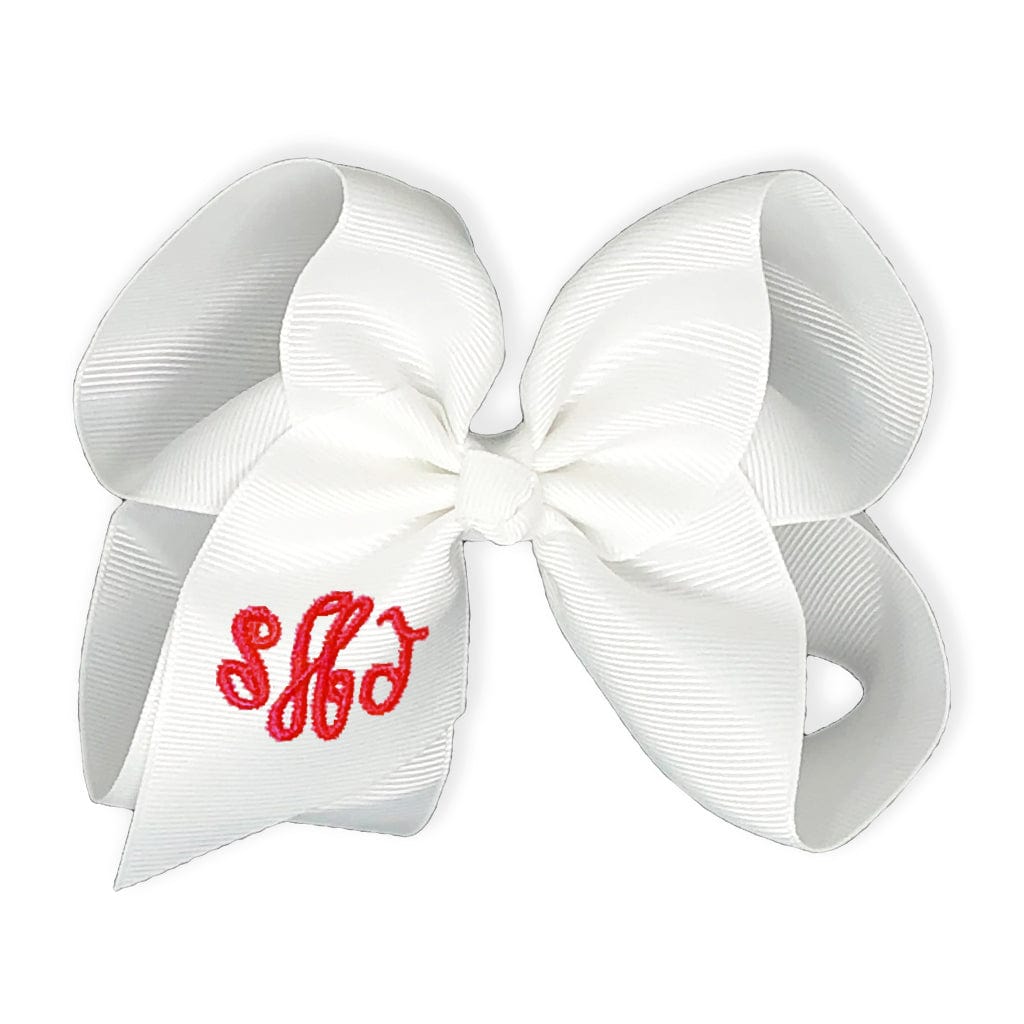 White bow with red monogram