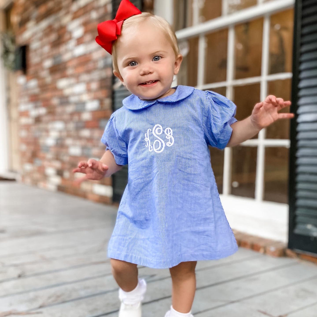 Monogrammed toddler girl dresses, toddler girl outside on a porch