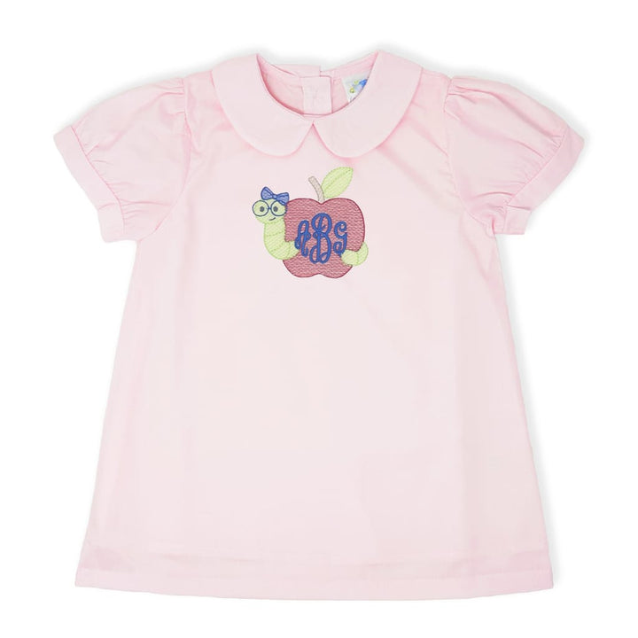 Girls dress with embroidered bookworm design and monogram