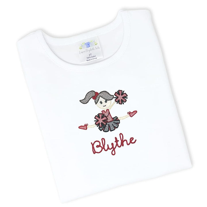 Girls tee with an embroidered cheerleader design and name in team colors