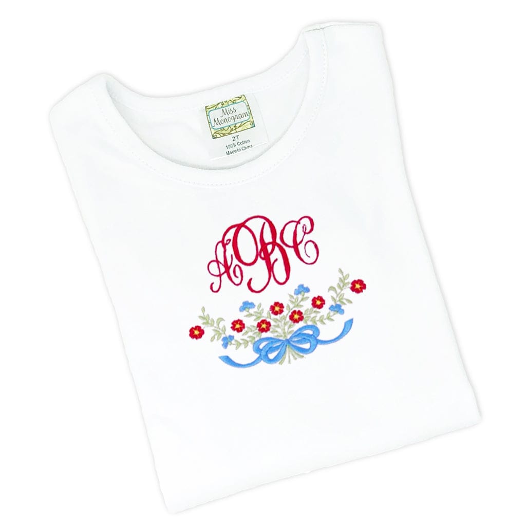 White TShirt with red and blue embroidered flowers and bow