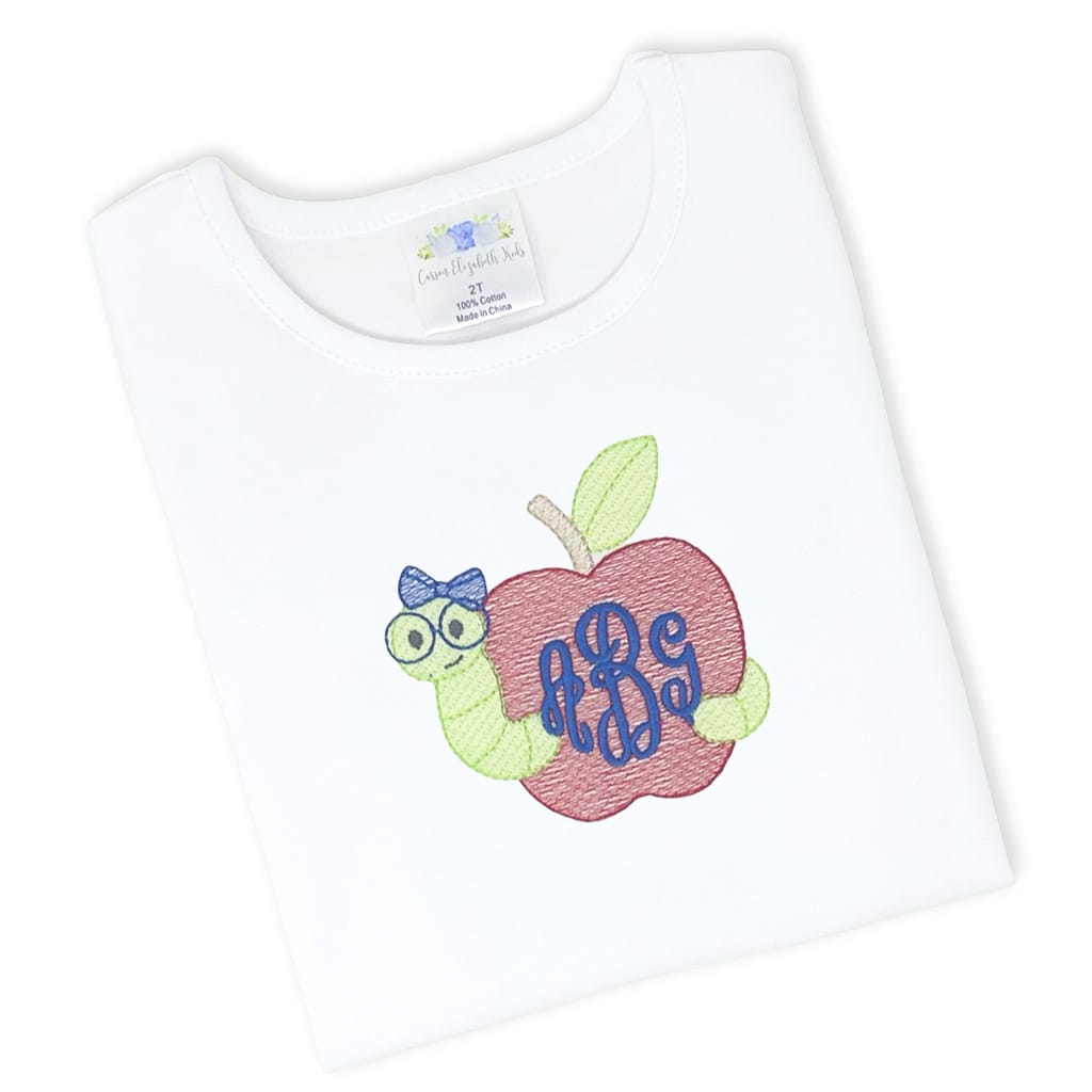 Girls white tee with embroidered bookworm design and monogram in script font
