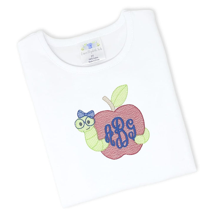 Girls white tee with embroidered bookworm design and monogram in script font