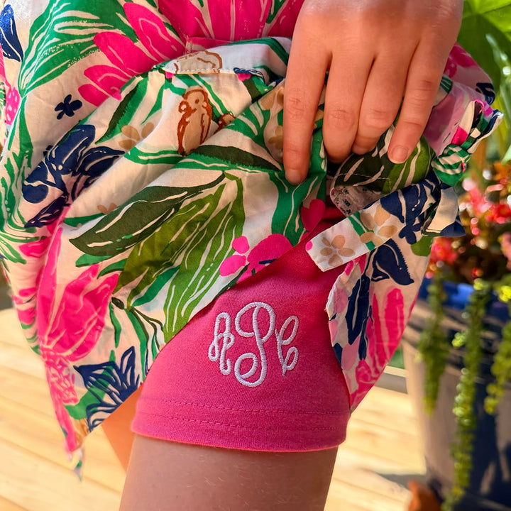 Girls Monogrammed Hot Pink Cartwheel Shorts under a floral dress