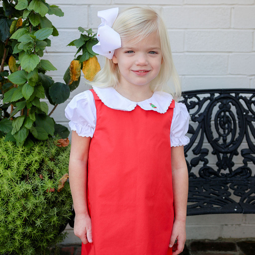 Holiday-themed Peter Pan shirt for girls with tree and red bow embroidery