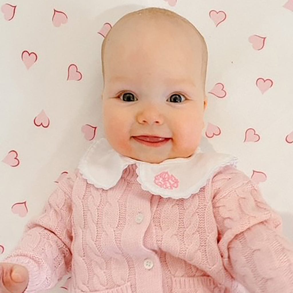 Baby girl in pink Peter Pan collar shirt