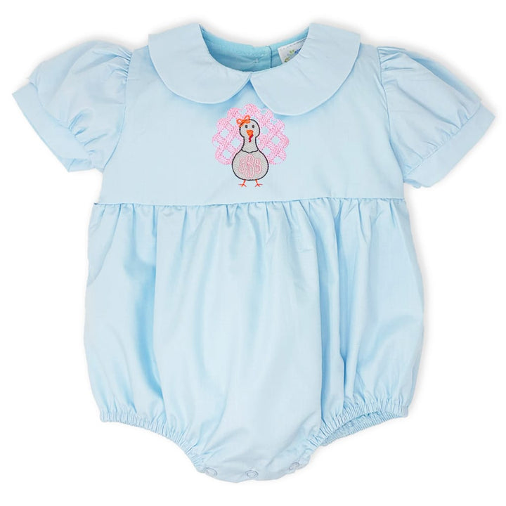 photo of a light blue turkey bubble with a peter pan collar and a pink monogrammed turkey on the front