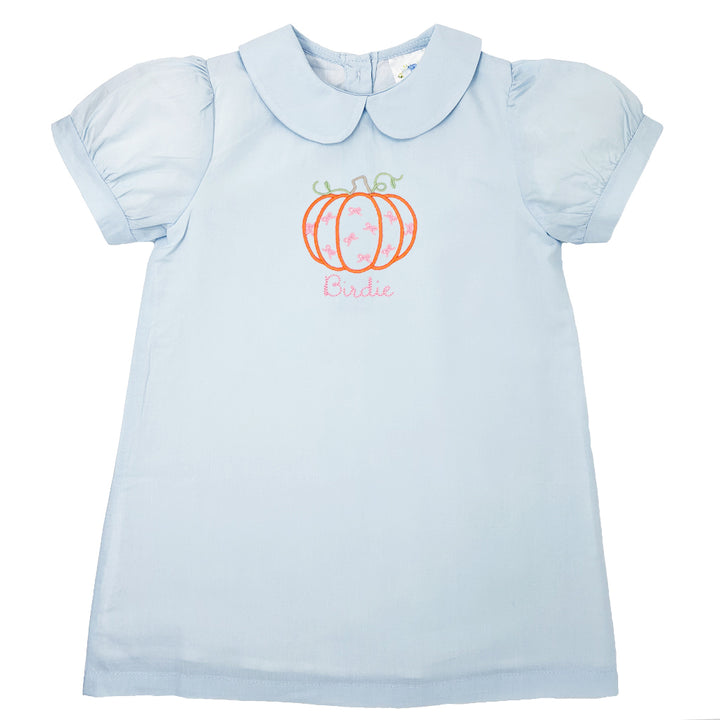 Autumn-inspired girl's dress with classic pumpkin embroidery and monogram for fall with peter pan collar