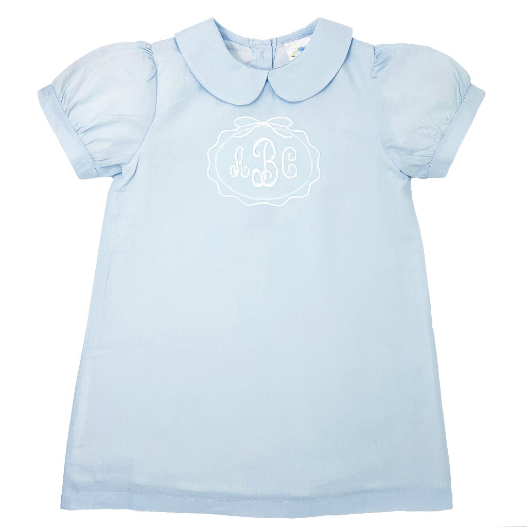 Light blue dress with white monogram and scallop bow frame